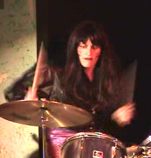 Dana as Wendy as Charmin on Drums in Angry Housewives